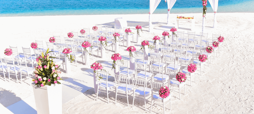 aerial shot of a beach wedding