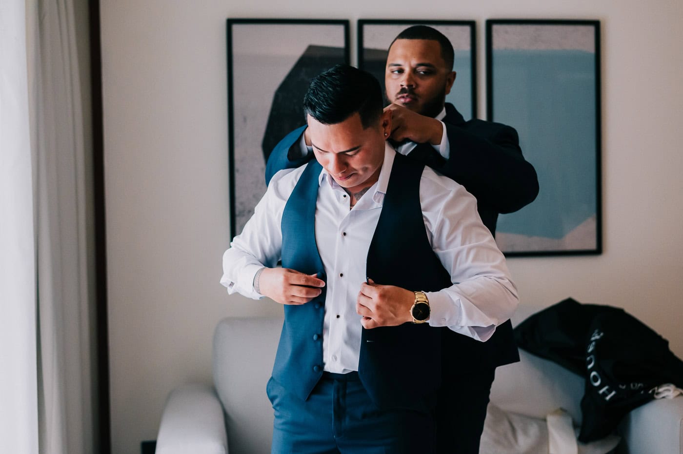 wedding at live aqua punta cana - groom getting dressed