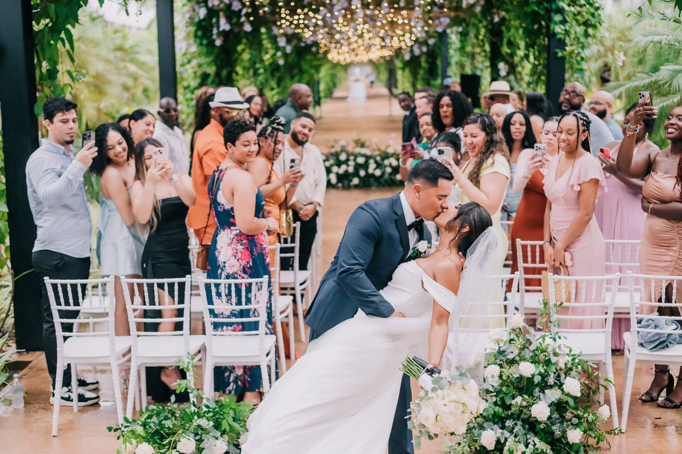 groom kissing his newly married bride