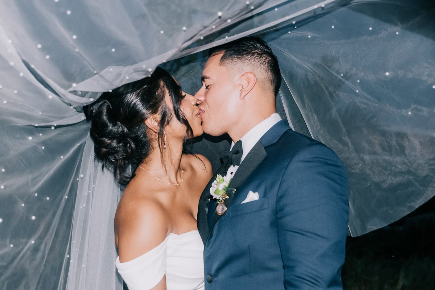 bride and groom share a kiss 