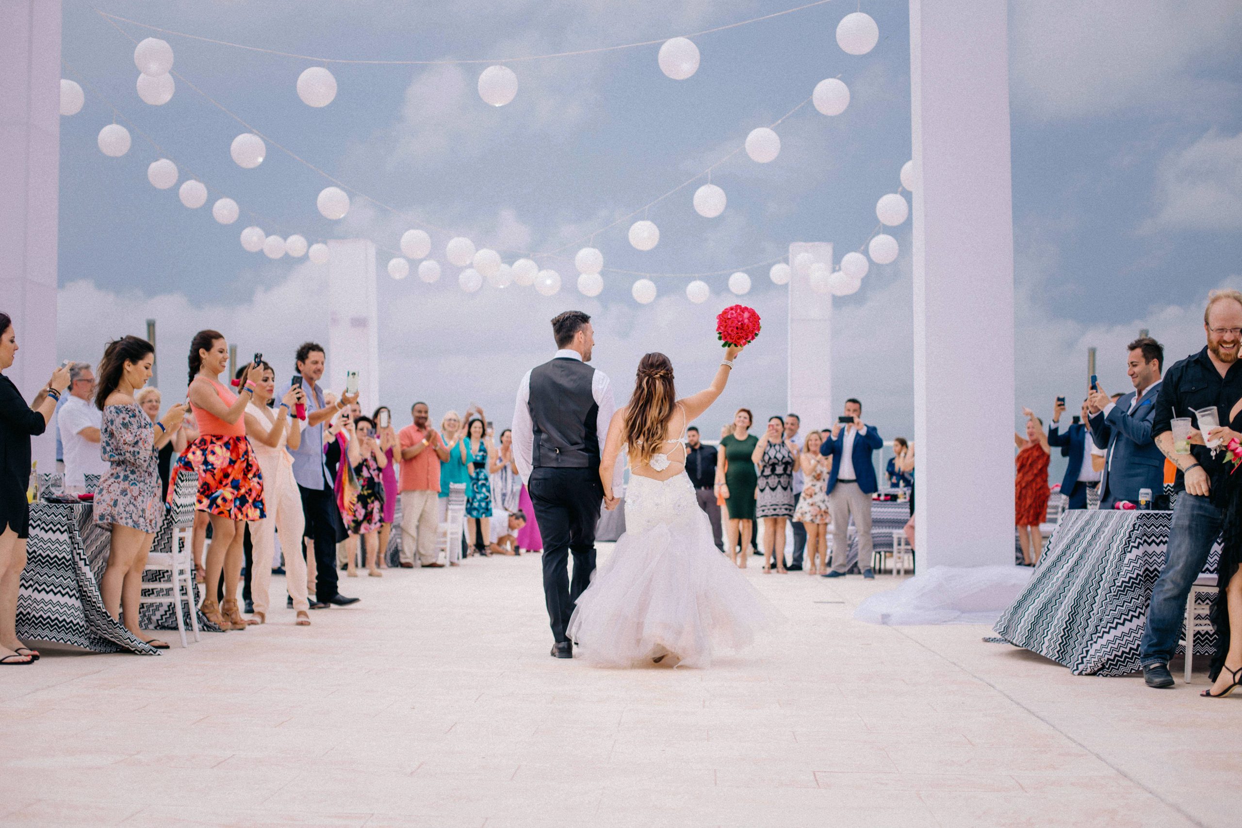 wedding day, newlyweds walking into thier reception together