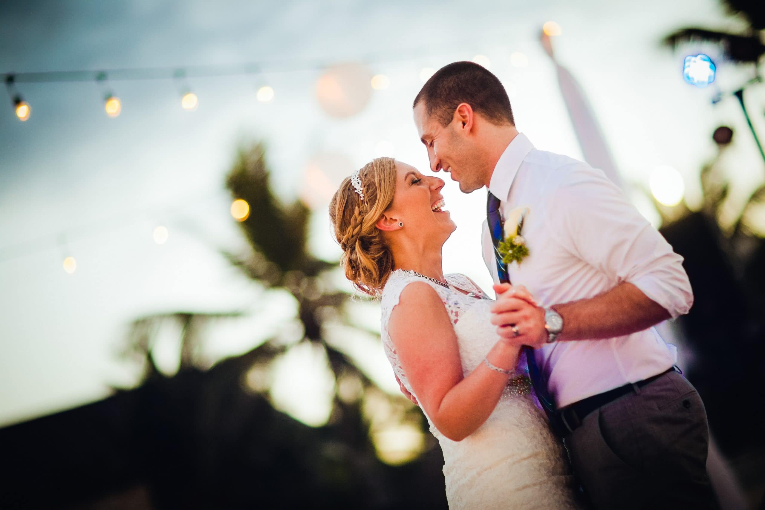 sweet moment of a newly married couple happily sharing a first dance together at thier wedding reception