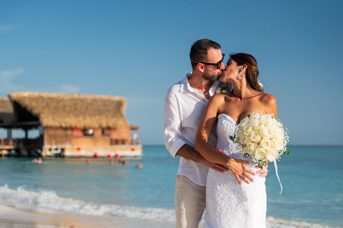 Bride and groom kissing at Sunsacape Dominicus Beach