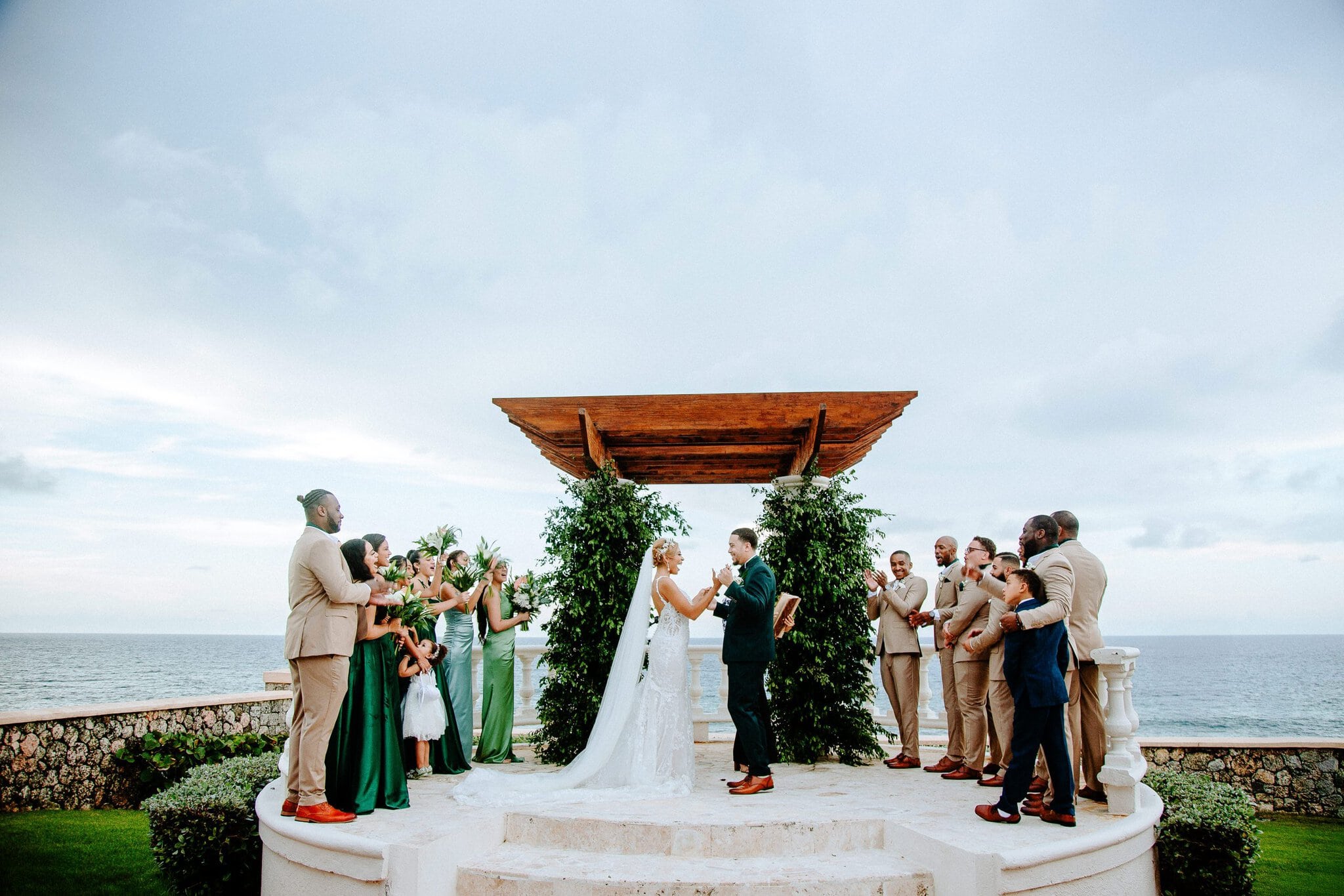Wedding party gathered at an oceanfront wedding ceremony