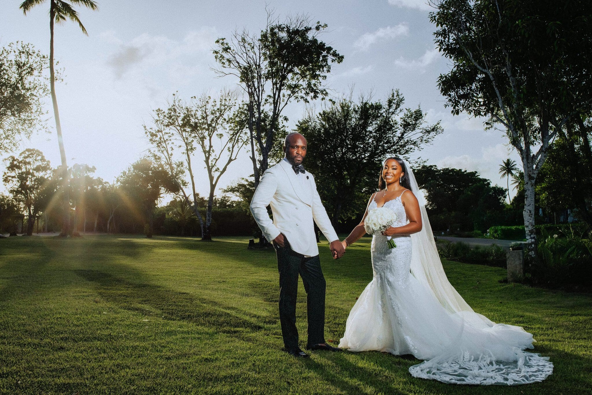 Bride and groom holding hands at golden hour during their Punta Cana destination wedding