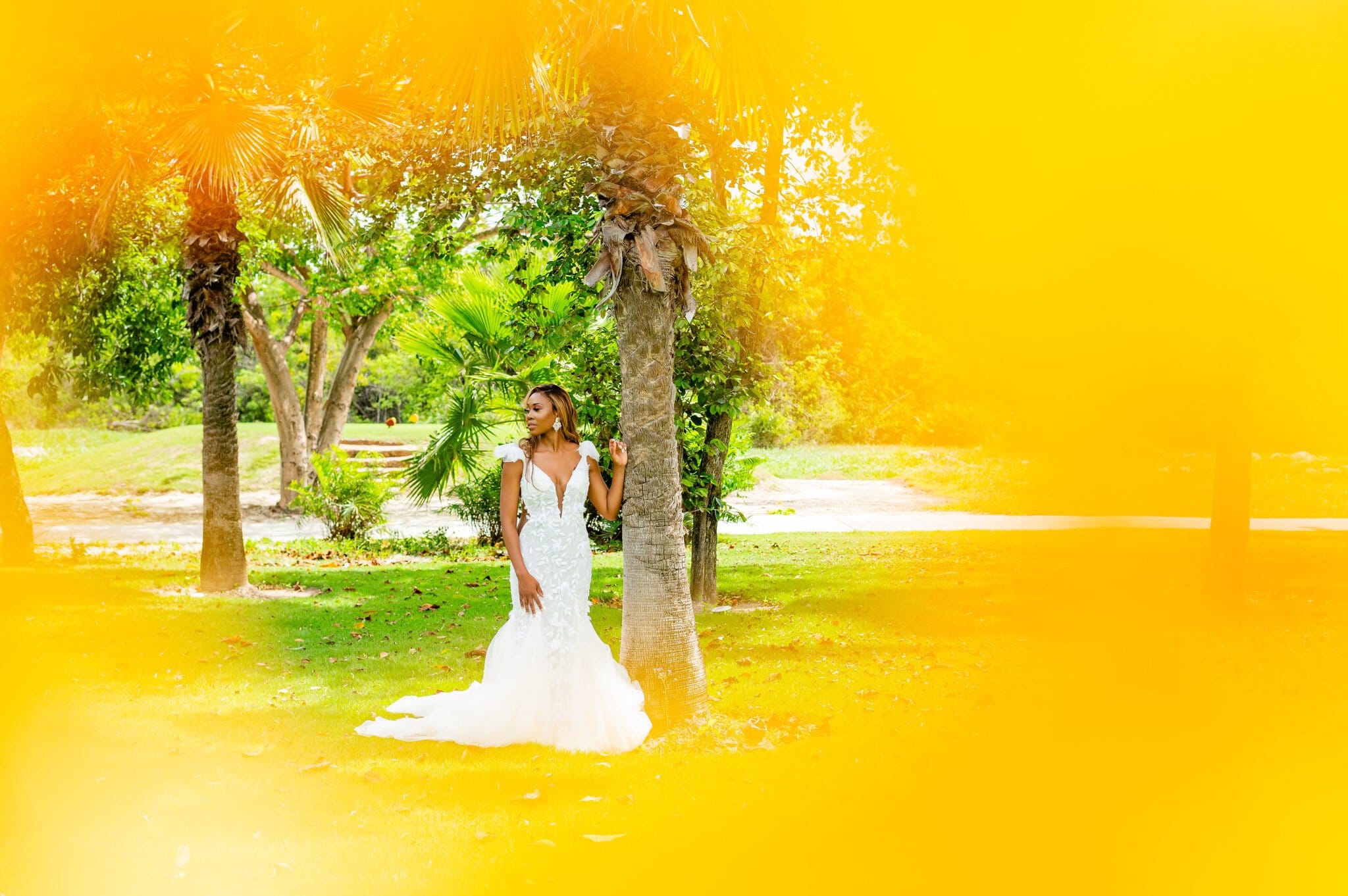 Bride holding her bouquet in golden light at her Dominican Republic wedding