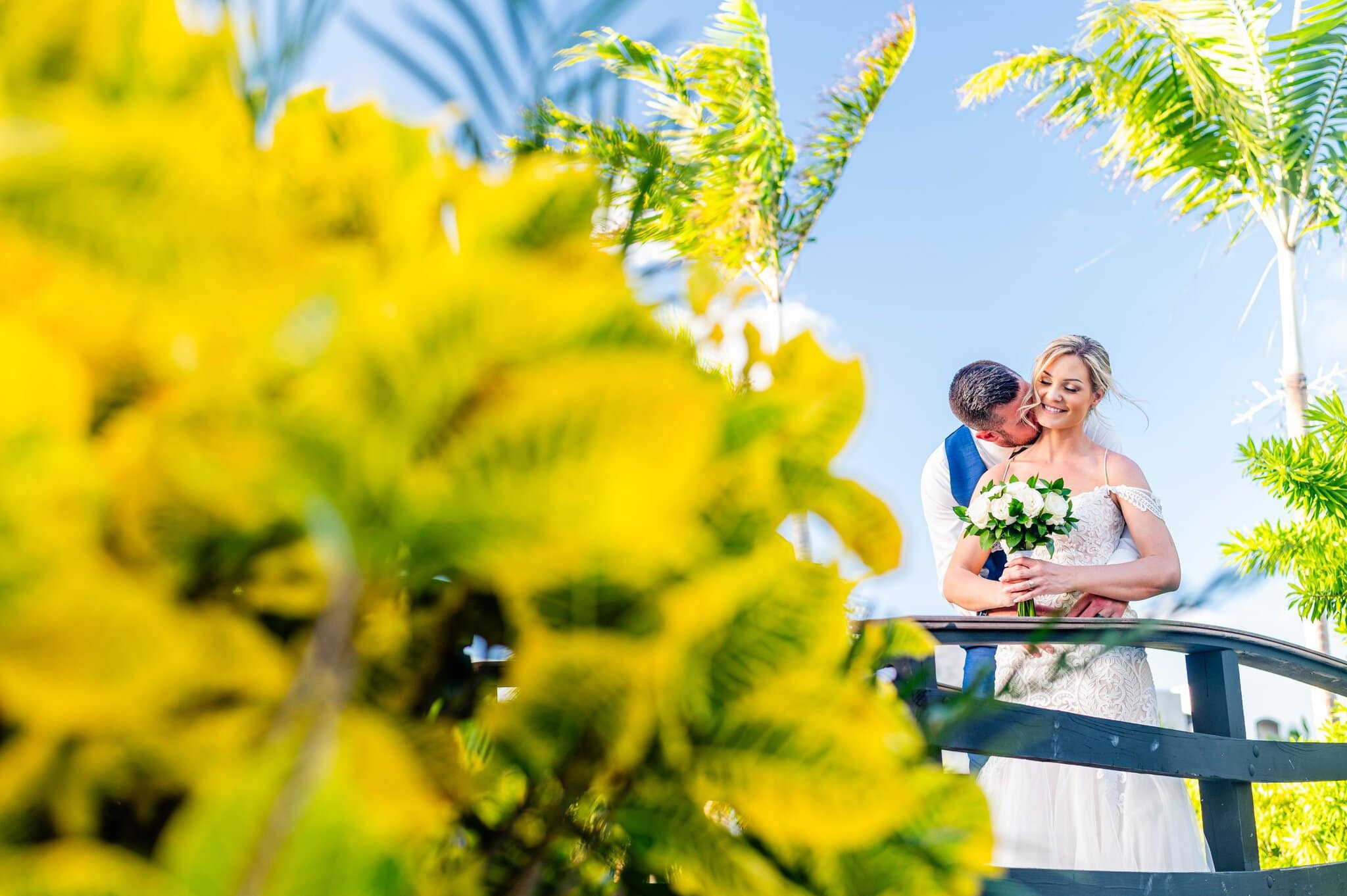 Newlyweds among tropical foliage at a Punta Cana wedding