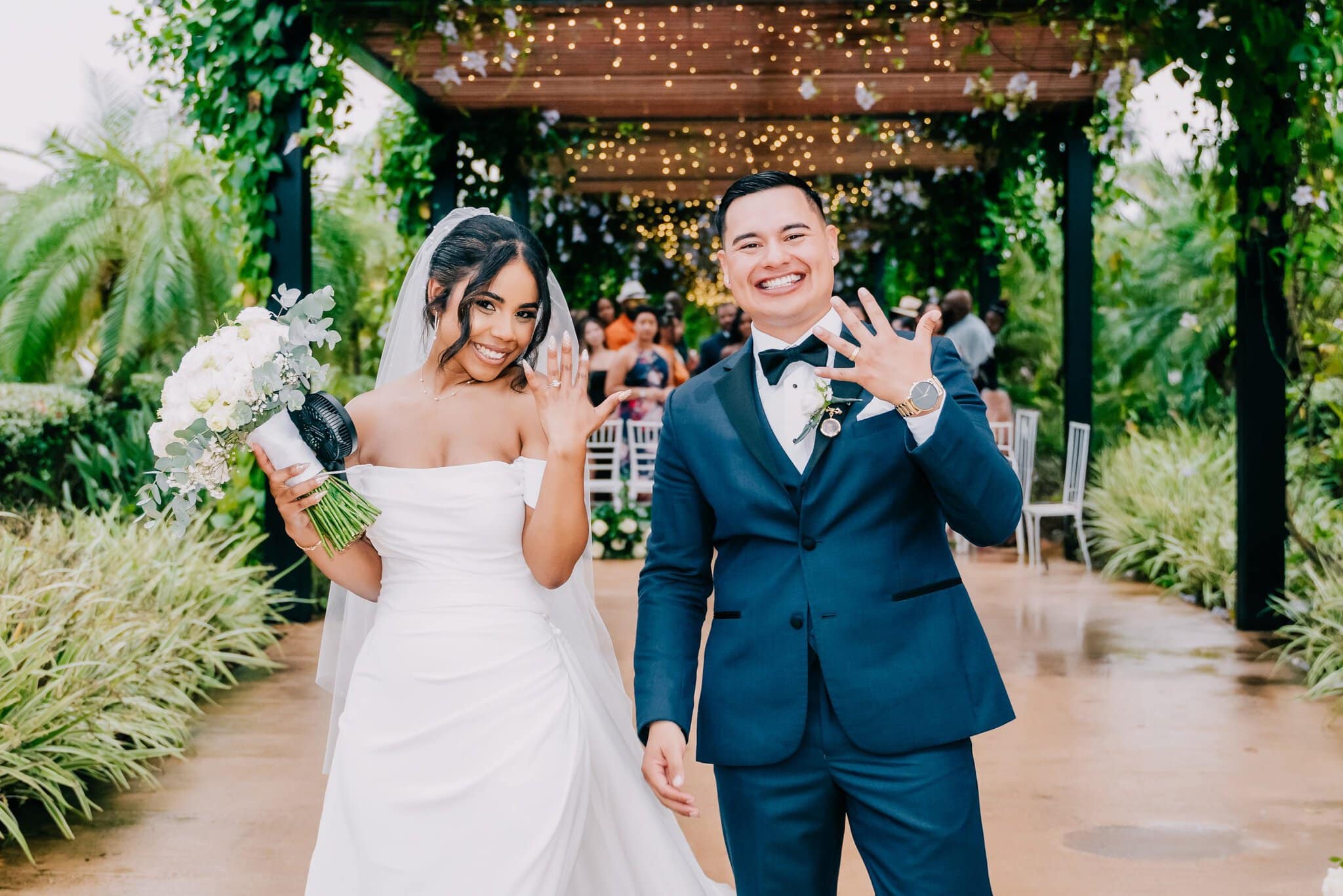 Newlyweds showing off their rings just after their Punta Cana wedding ceremony